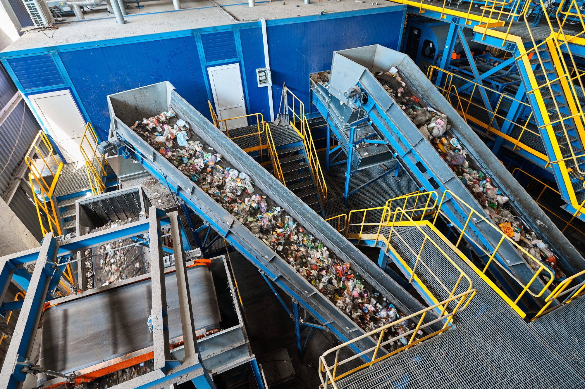 Large,Production,Line,With,Conveyors,Carrying,Trash,At,Plant